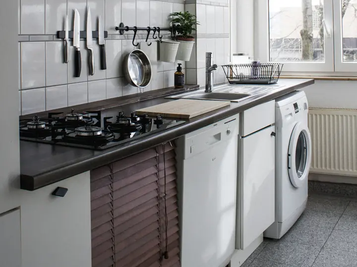 Open dishwasher ready for filter spray arm seal and rack maintenance