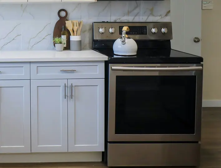 Clean oven and range prepared for a monthly safety and performance inspection